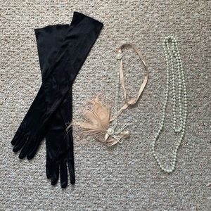 Flapper costume headband, gloves, and pearls.